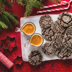 s festive decorations on the table and two cups of espresso coff