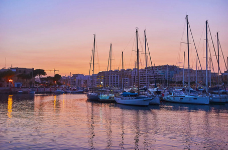 Xbiex and Msida yacht marina in bright lights of the evening sky