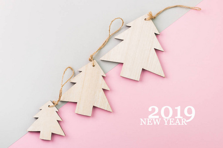 s Day festive decoration, wooden Christmas tree on pink and gray