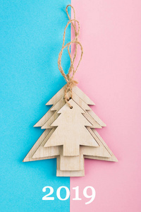 s Day festive decoration, wooden Christmas trees on pink and blu