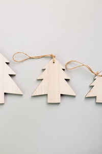 s Day festive decoration, wooden Christmas trees on gray backgro