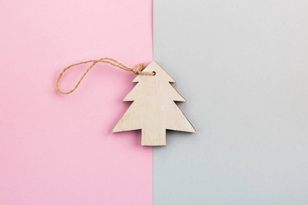 s Day festive decoration, wooden Christmas tree on pink and gray