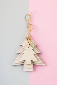 s Day festive decoration, wooden Christmas trees on pink and gra