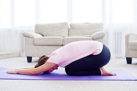 s pose, full length. Relaxing and doing yoga, resting, stretchin