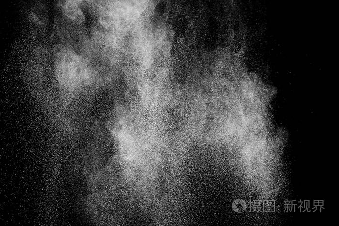 白色粒子在黑色背景上的冻结运动粉末爆炸抽象灰尘覆盖纹理