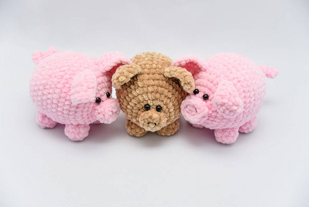 s toys depicting a baby pig. soft toy pig on white background.