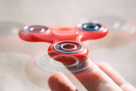  improve reaction.Trendy portable spinning toy in male hand 