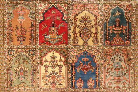 土耳其东方地毯的质地。 传统的地板盖设计背景。 美丽的纺织地毯装饰背景。