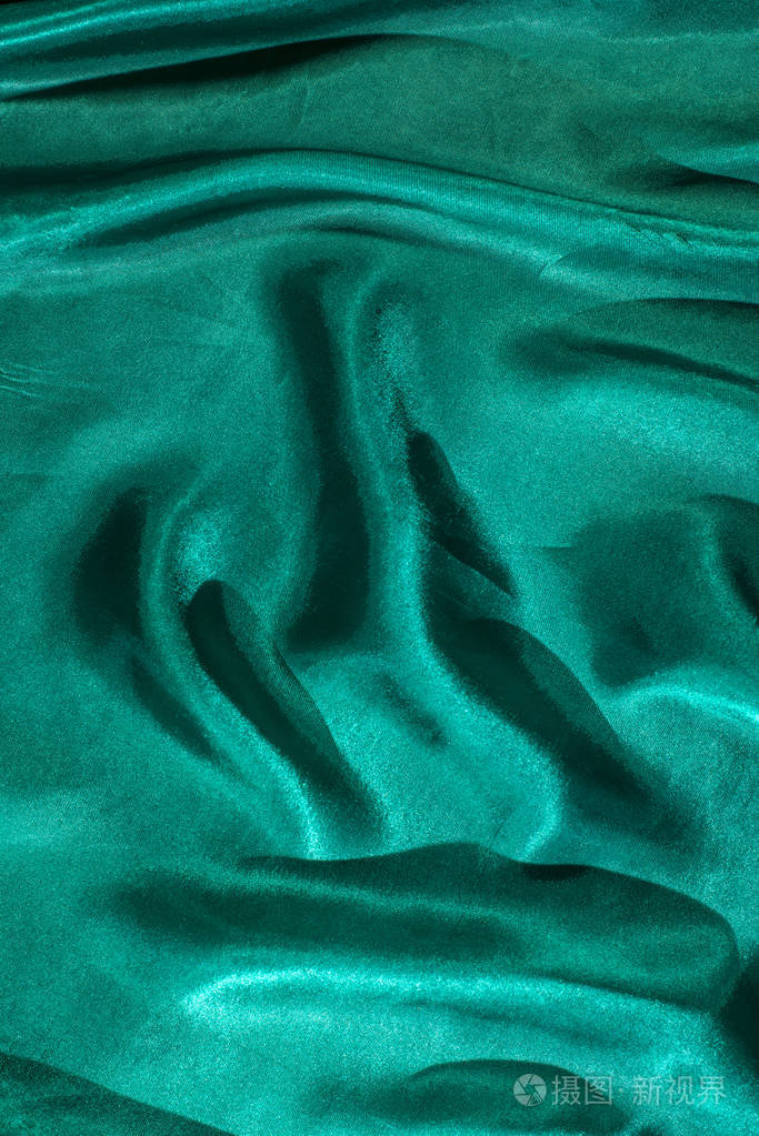 闪亮的绿色丝绸背景.