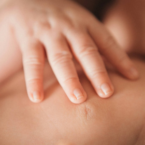 s hand closeup lying on his stomach