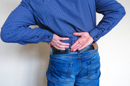 背痛.遭受痛苦照片