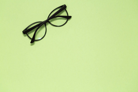 s glasses on green background. Stylish women39