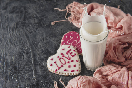 s Day breakfast. Heartshaped cookies and a glass  of milk on a 