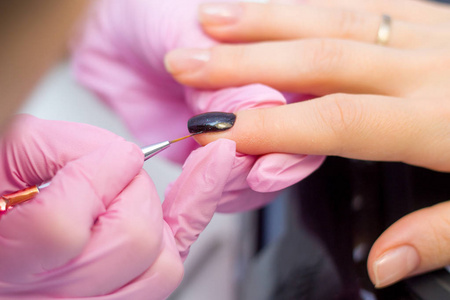 s Nails. Woman In Beauty Salon