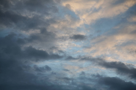 s rays illuminate the clouds.