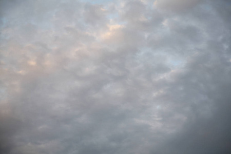 s rays illuminate the clouds.