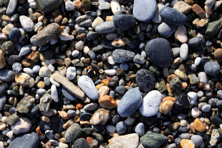 航海海洋背景。 海滩上的鹅卵石。