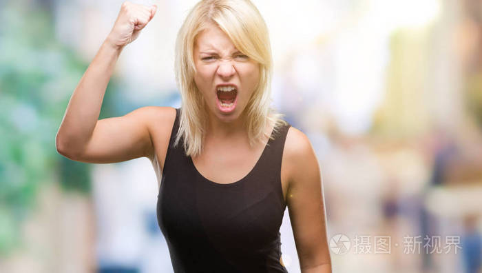 年轻漂亮的金发美女,穿着优雅的裙子,在孤立的背景下