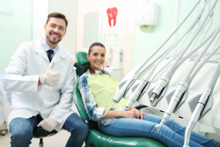 s equipment and blurred doctor with patient on background