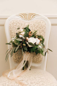 s bouquet in pastel colors with roses, spruce, cotton, black ber