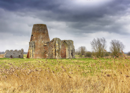 s Abbey gatehouse and mill on the Norfolk Broads during a winter