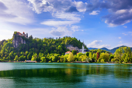 s Church and Bled town with reflection in the lake and the Julia