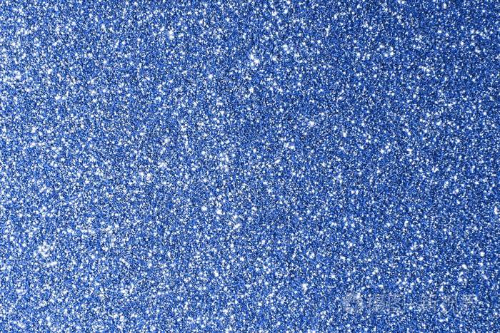 奇妙的蓝色闪闪发光金属砂详细表面圣诞概念纹理抽象照片背景
