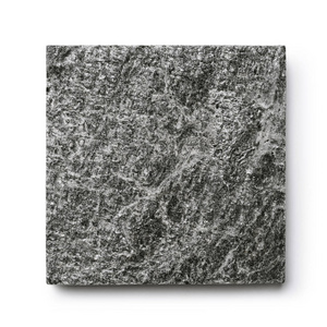 花岗岩背景。 灰色花岗岩石材的纹理。 灰色色调的自然图案。 抽象背景