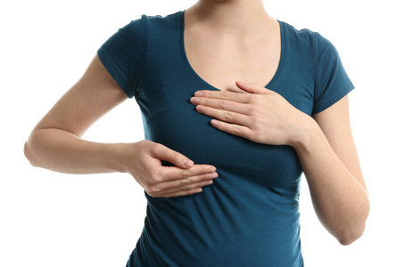 孕妇哺乳孕妇在白色背景下触摸乳房照片