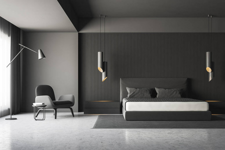 现代卧室内部有灰色墙壁,混凝土地板,灰色主床,灰色毛毯,床头柜和扶手