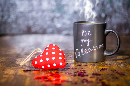 s day concept with black cup, chalk inscription on a mug and a r