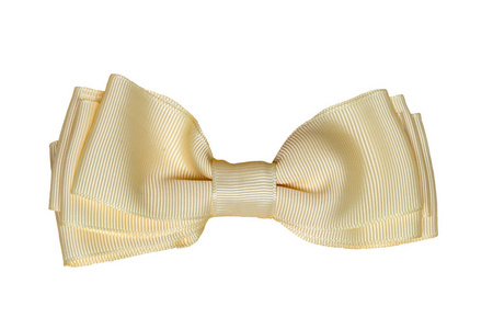 礼品蝴蝶结。 一种装饰金或黄色的蝴蝶结，由白色背景上隔离的礼品盒用织物制成。 装饰背景。