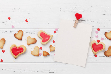 s day greeting card with heart shaped cookies on wooden backgrou