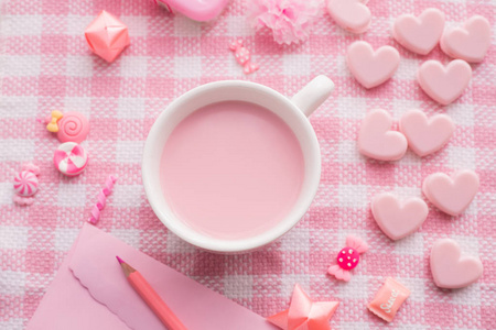 s day holiday celebration with cup of milk on pink tablecloth an