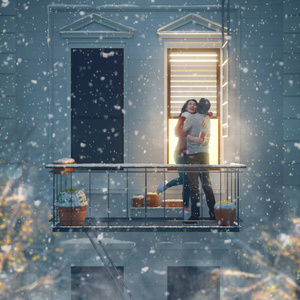 浪漫的夫妇拿着情人节礼物站在阳台上约会。