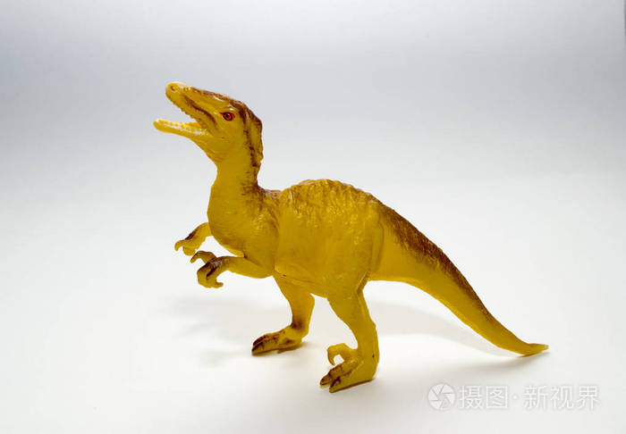 白色背景上的玩具恐龙测速器