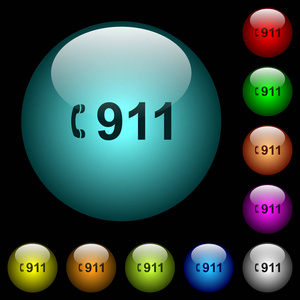 紧急呼叫911图标的彩色照明球形玻璃按钮在黑色背景。 可用于黑色或深色模板