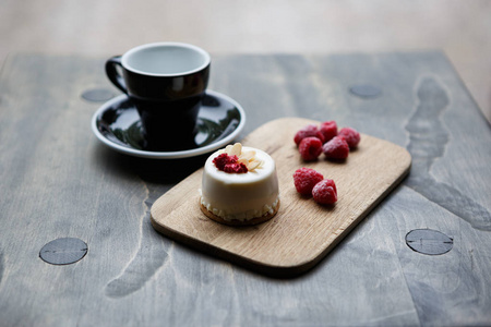  coffee cup in pastry cafe.Tasty fresh cake with berries amp