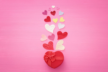 s day concept. Paper hearts over wooden pink background. Flat la