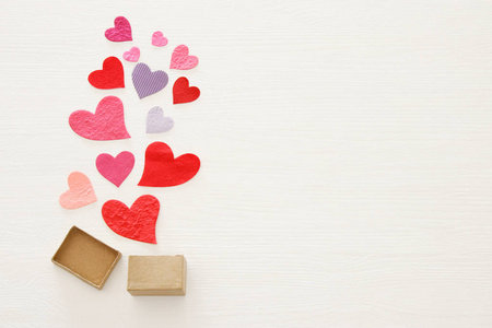s day concept. Paper hearts over wooden white background. Flat l