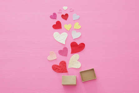 s day concept. Paper hearts over wooden pink background. Flat la