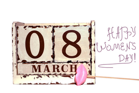 s Day with wooden block calendar and pink lips on a stick, isola