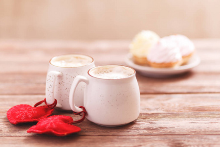 s Day or Birthday, Christmas. Wooden background. Cakes on blurre