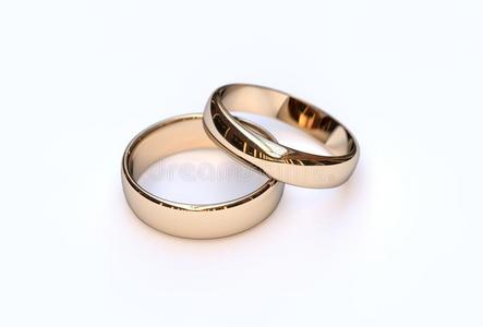 白色背景上的一对金色结婚戒指