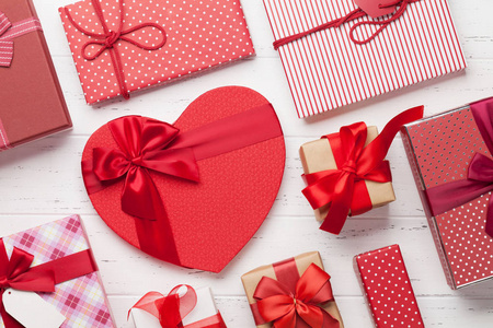 s day greeting card with heart gift boxes on wooden background