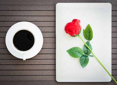 s day concept ,Desk table with laptop,notebook, coffee cup,red r