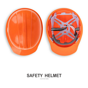 创意布局制作橙色安全帽隔离在白色背景与剪裁路径
