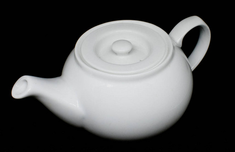背景上的白瓷茶壶