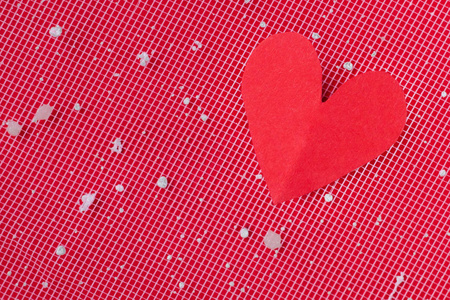 红色的心脏在一个红色的背景。情人节的背景