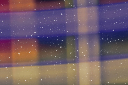 背景与离焦的Bokeh灯模糊的彩色Bokeh抽象在不聚焦的背景与降雪效果。